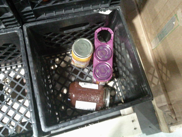 Four jars in a crate.